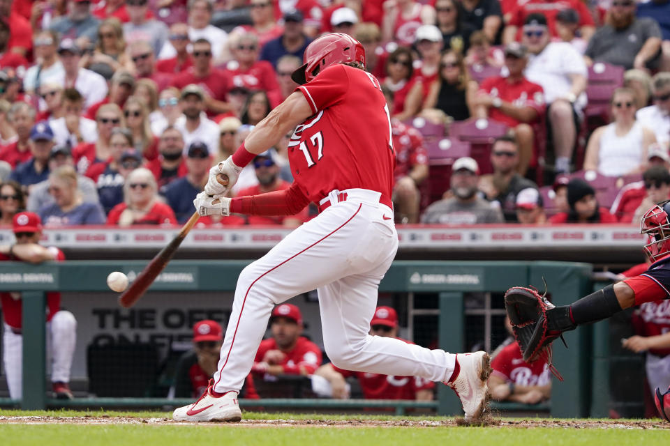 Cincinnati Reds' Kyle Farmer (17) hits a two-run single during the first inning of a baseball game against the Washington Nationals Saturday, June 4, 2022, in Cincinnati. (AP Photo/Jeff Dean)