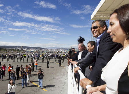 Ecuador's President Rafael Correa (2nd R) looks at preparations underway at the Bicentenario Park, where Pope Francis will hold a mass during his visit, in Quito, Ecuador, June 30, 2015. REUTERS/Guillermo Granja