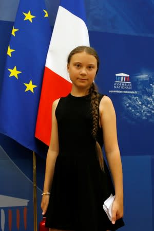 Swedish environmental activist Greta Thunberg arrives to attend a debate with French parliament members at the National Assembly in Paris