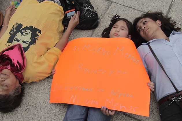 Protesters take part in a demonstration against femicide and violence against women in downtown Mexico City. The protesters staged a 'die-in', lying underneath the Angel of Independence statue, on the same day of #NiUnaMenos (Not One More) demonstrations in 70 cities across Argentina. Photo: AAP