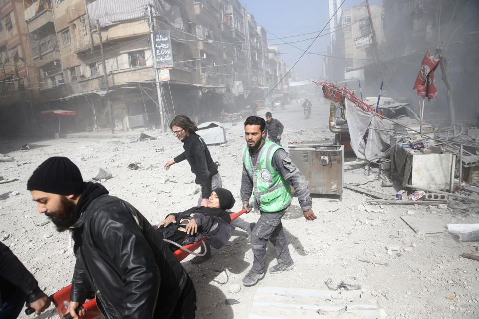 <p>An injured woman is carried on a stretcher after an airstrike in the besieged town of Douma in eastern Ghouta in Damascus, Syria, Feb. 7, 2018. (Photo: Bassam Khabieh/Reuters) </p>