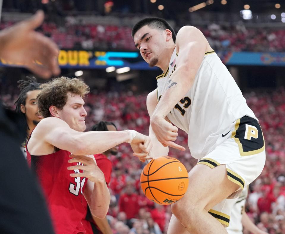 North Carolina State Wolfpack forward Ben Middlebrooks (34) defends Purdue Boilermakers center Zach Edey (15) during the NCAA Men’s Basketball Tournament Final Four game, Saturday, April 6, 2024, at State Farm Stadium in Glendale, Ariz.