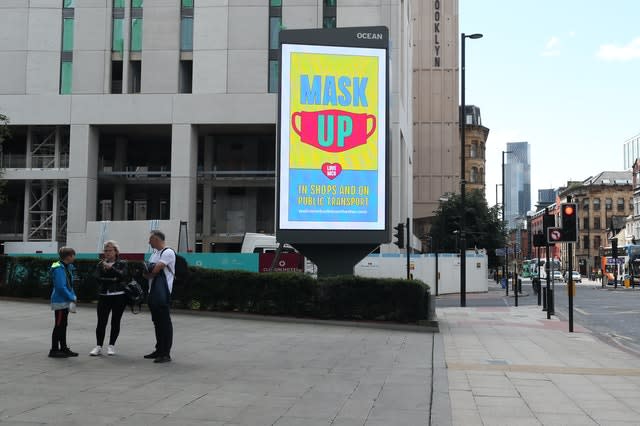 An advertisement in Manchester promoting guidelines for wearing masks (Peter Byrne/PA)