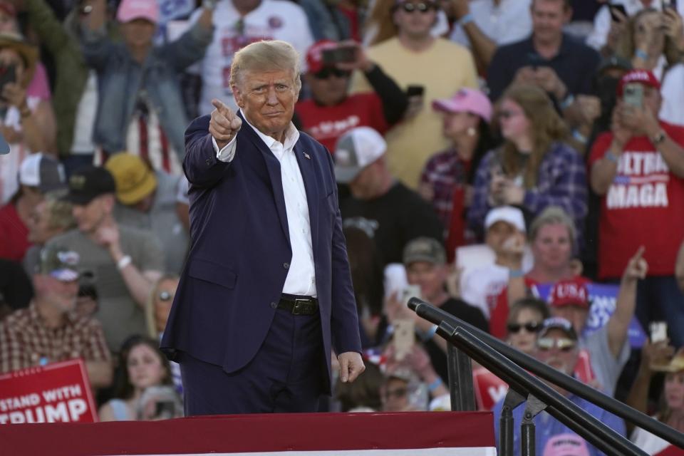 Former President Donald Trump gestures to supporters after speaking at a campaign rally at Waco Regional Airport Saturday, March 25, 2023, in Waco, Texas.