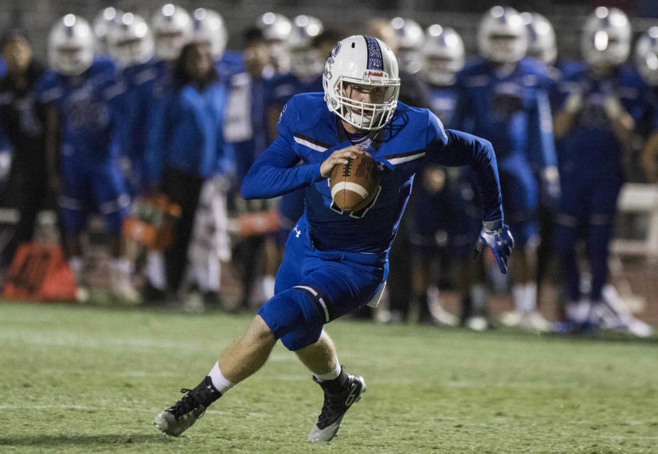 Chandler's Jacob Conover looks to run against Highland's  defense during their game in Chandler Friday, Nov.16, 2018.