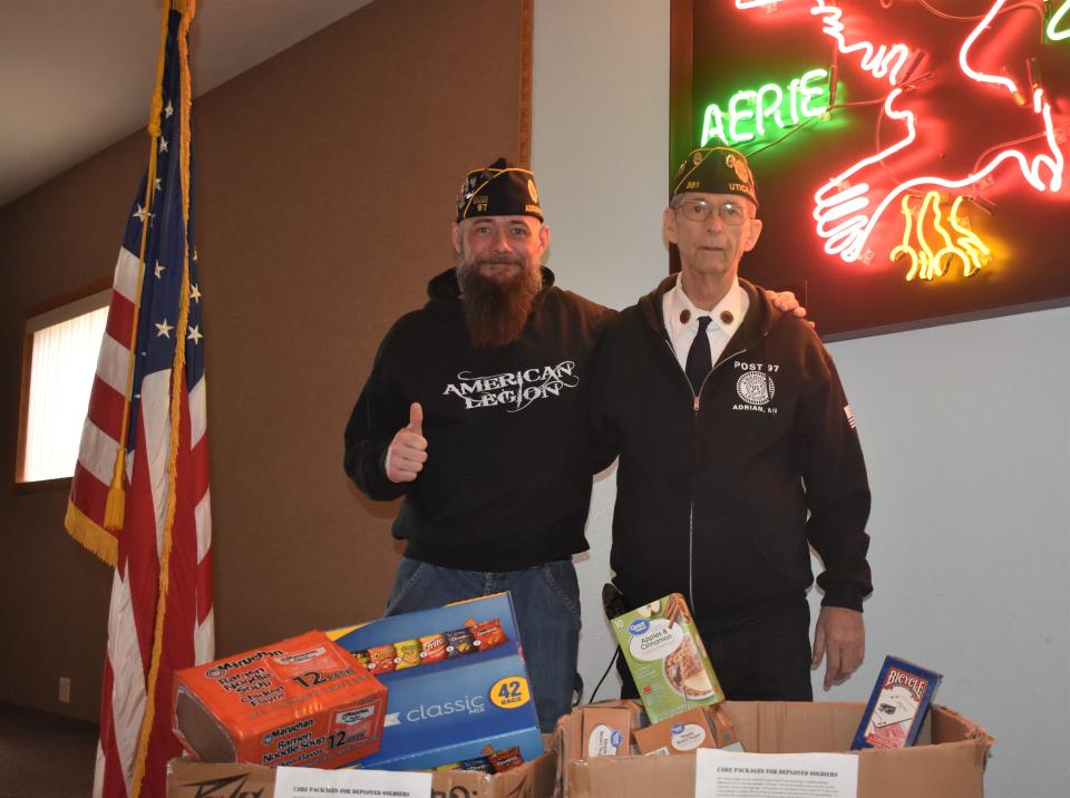 Jim Flarity, left, and Terry Graham, right, both members of the Adrian Eagles Order No. 2371 and American Legion Post 97 in Adrian, have been in charge of coordinating a collection of items to be included in care packages for nine soldiers deployed to Syria. The soldiers, who are part of the Army National Guard, all have ties to Lenawee County.