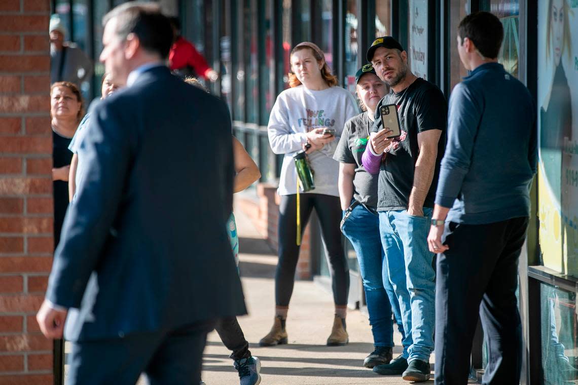 People wait to catch a glimpse of Vice President Kamala Harris during her visit to the Panaderia Artisanal bakery on Monday, January 30, 2023 in Raleigh, N.C.