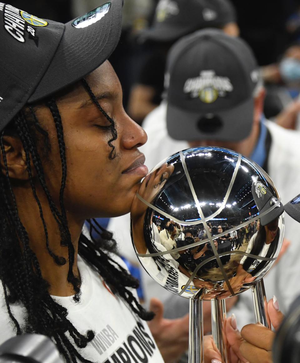 Diamond DeShields enjoys a moment with the WNBA championship trophy.