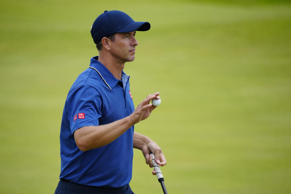 Australia's Adam Scott acknowledges the crowd on the 18th green after putting during the third day of the British Open Golf Championships at the Royal Liverpool Golf Club in Hoylake, England, Saturday, July 22, 2023. (AP Photo/Jon Super)