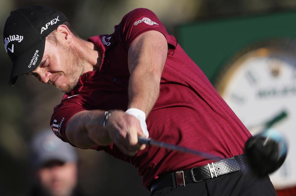 England's Danny Willett tees off on the 14th hole during the second round of the Abu Dhabi Championship golf tournament in Abu Dhabi, United Arab Emirates, Friday, Jan. 17, 2020. (AP Photo/Kamran Jebreili)