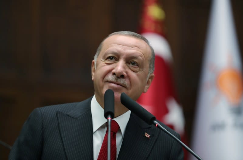 Turkish President Tayyip Erdogan addresses members of parliament from his ruling AK Party during a meeting at the Turkish parliament in Ankara