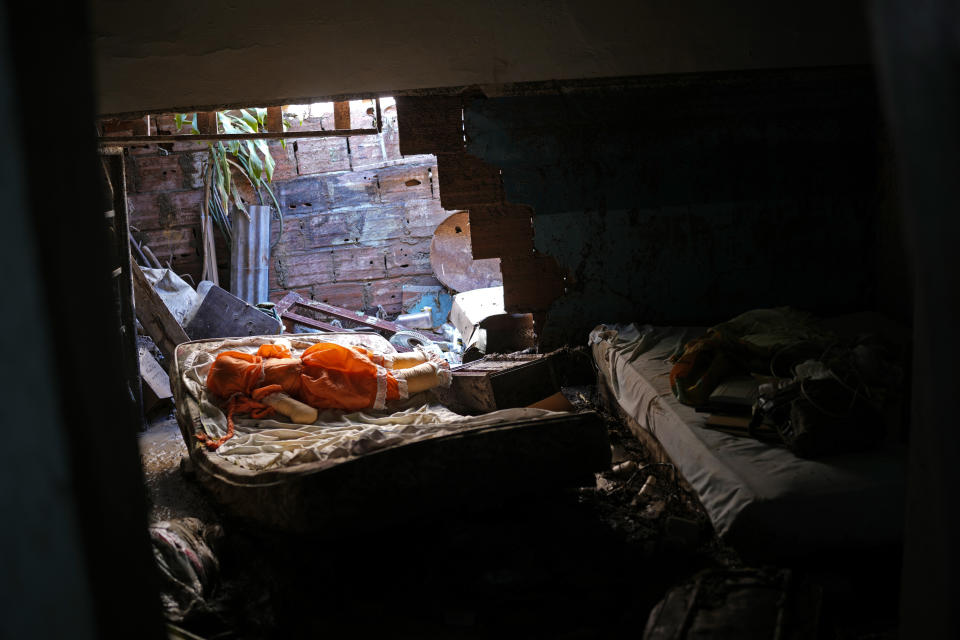 The home of Jose Medina's family is in disarray after flooding in Las Tejerias, Venezuela, Monday, Oct. 10, 2022. A fatal landslide fueled by flooding and days of torrential rain swept through this town in central Venezuela. (AP Photo/Matias Delacroix)