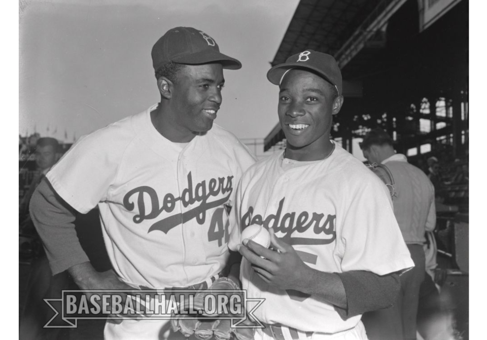 Jackie Robinson, left, and Sandy Amoros posed together on the field at Ebbets Field, taken in 1952.