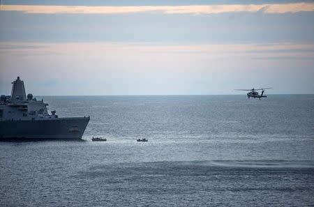 A supplied image obtained from the U.S. Defence Force on August 6, 2017 shows search efforts for three U.S. Marines missing after their MV-22 Osprey tilt-rotor aircraft crashed into the sea off Australia's northeast coast. III MEF Marines, MC2 Sarah Villegas/Handout via REUTERS