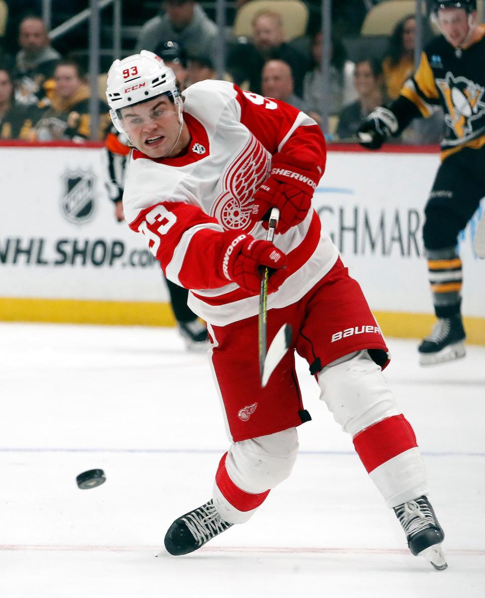 Detroit Red Wings Detroit Red Wings right wing Alex DeBrincat (93) takes a slap shot against the Pittsburgh Penguins during the second period at PPG Paints Arena in Pittsburgh, on Wednesday, Oct. 4, 2023.