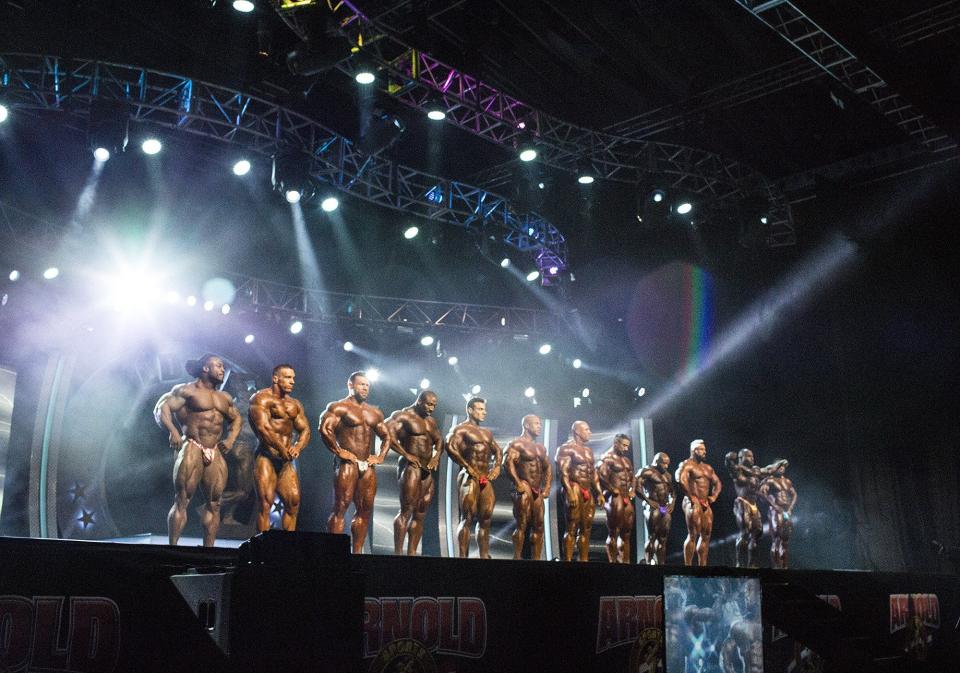 Men's Bodybuilding competitors line up for judging at the start of the Arnold Classic Pose Down at the Arnold Sports Festival in 2019.