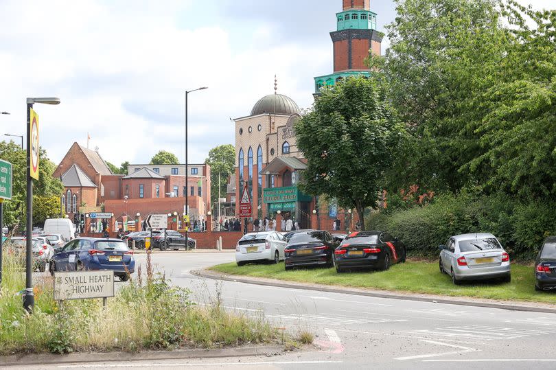 Cars parked on Poets Corner roundabout at Small Heath. -Credit:SWNS