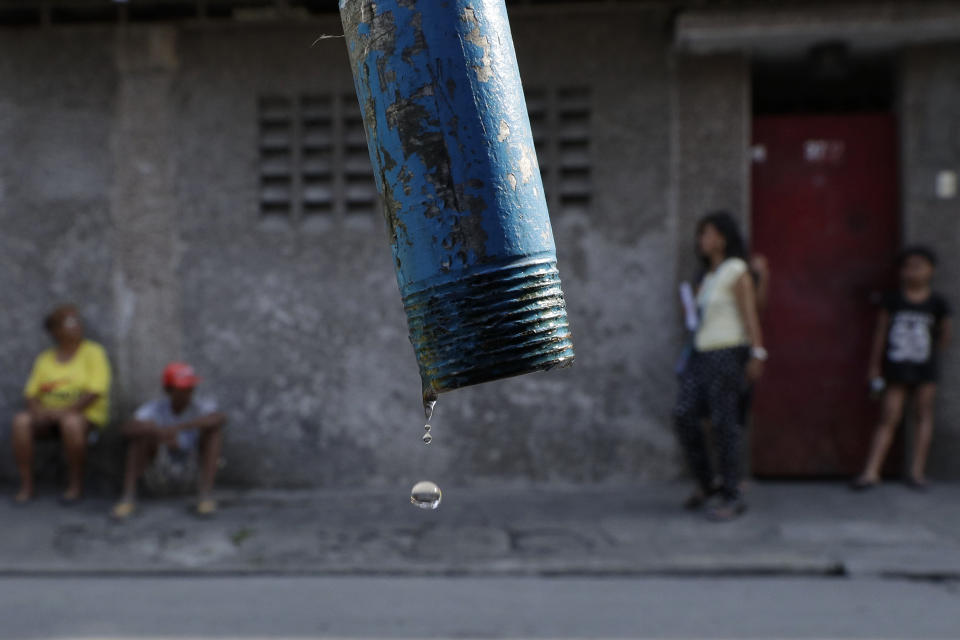 In this March 13, 2019, photo, water drops from a faucet as residents wait for trucks bearing water to return in Mandaluyong, metropolitan Manila, Philippines. Parts of metropolitan Manila are suffering from water shortage due to the continued dip of levels at the La Mesa dam as the country enters the dry season and the onset of El Nino which causes below normal rainfall conditions. (AP Photo/Aaron Favila)