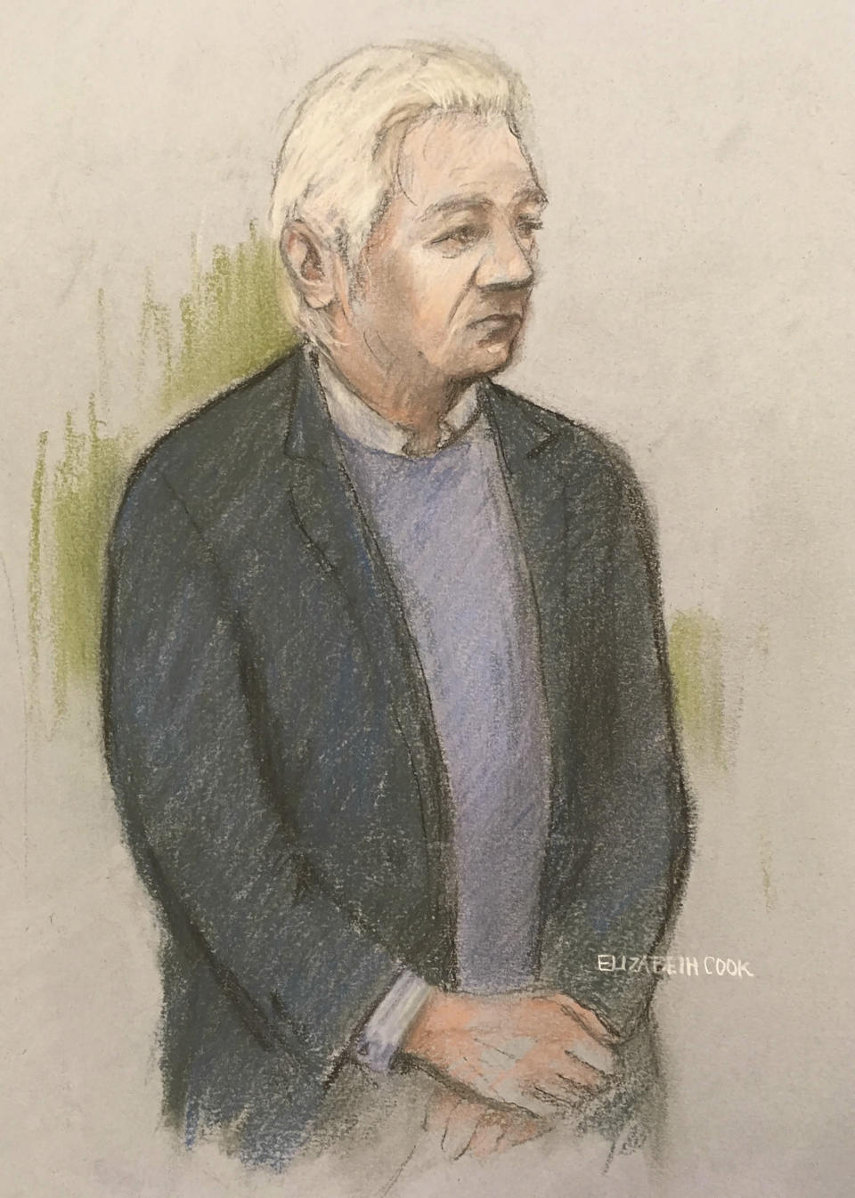 Courts artist sketch by Elizabeth Cook showing Julian Assange as he appeared at Westminster Magistrates' Court in London Monday Oct. 21, 2019, for a hearing related to his extradition to the United States. WikiLeaks founder Julian Assange appeared in court Monday to fight extradition to the United States on charges of espionage, with the full extradition hearing set for February 2020. (Elizabeth Cook/PA via AP)