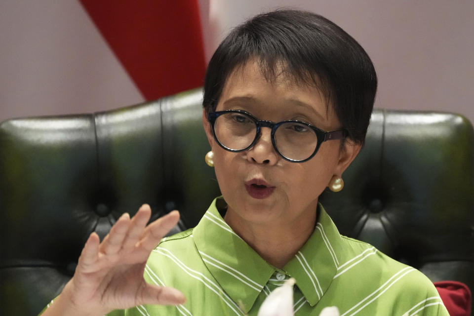 Indonesian Foreign Minister Retno Marsudi speaks during a news conference in Jakarta, Indonesia, Friday, May 5, 2023. Indonesian authorities said Friday they were trying to rescue dozens of its nationals who got trafficked to Myanmar's Kayin State to work as cyber scammers amid growing numbers of human trafficking victims in Southeast Asian region. (AP Photo/Achmad Ibrahim)