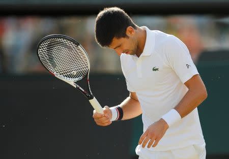 Tennis - Wimbledon - London, Britain - July 12, 2017 Serbia’s Novak Djokovic reacts as he retires from his quarter final match against Czech Republic’s Tomas Berdych with an injury REUTERS/Matthew Childs