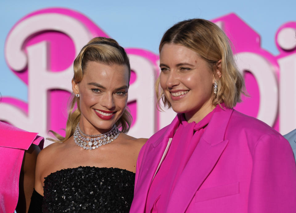 Margot Robbie, left, and writer/director/executive producer Greta Gerwig arrive at the premiere of "Barbie" on Sunday, July 9, 2023, at The Shrine Auditorium in Los Angeles. (AP Photo/Chris Pizzello)