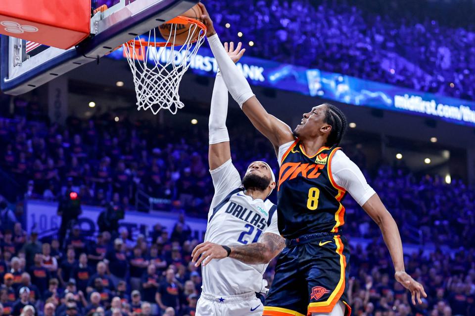 Thunder forward Jalen Williams (8) dunks the ball over Mavericks center Daniel Gafford (21) in the second quarter in Game 5 of the Western Conference semifinals on Wednesday at Paycom Center.