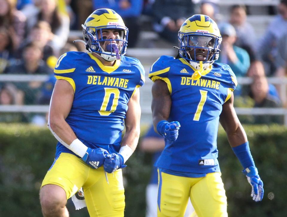 Delaware's Joe Zubillaga (0) and Kedrick Whitehead enjoy a stop on defense in the second quarter at Delaware Stadium, Saturday, Oct. 23, 2021.