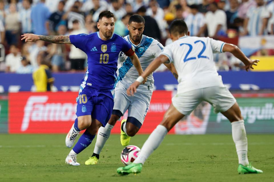 Lionel Messi (10) dribbles the ball during Argentina's pre-Copa America tune-up match against Guatemala at Commanders Field.