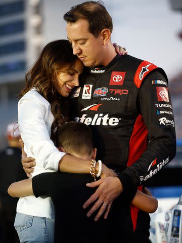 <p>Jared C. Tilton/Getty</p> Kyle Busch, Samantha Busch, and their son Brexton Busch prior to the NASCAR Camping World Truck Series North Carolina Education Lottery 200 on May 27, 2022 in Concord, North Carolina.