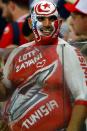 <p>World of colour: This Tunisia fan left little to the imagination with his colourful and revealing get-up. (Getty) </p>