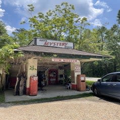 the exterior of the abita mystery museum which looks like an old gas station
