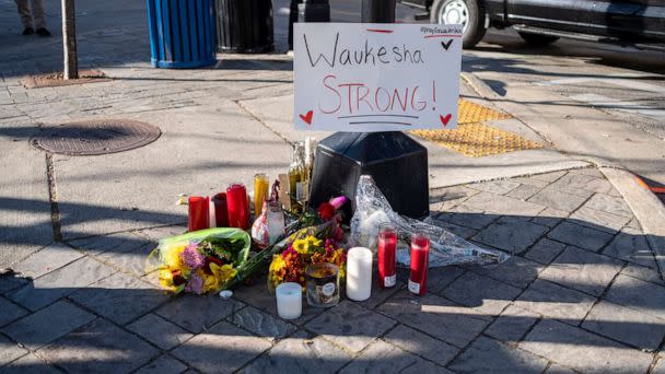 PHOTO: In this Nov. 22, 2021, file photo, memorials are left in areas where people were hit by a driver plowing into the Christmas parade on Main Street in Waukesha, Wis. (Jim Vondruska/Getty Images, FILE)