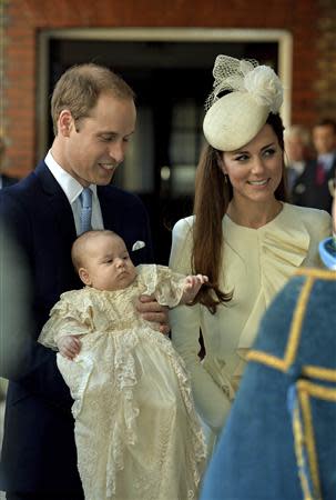 Britain's Prince William carries his son Prince George, as he arrives with his wife Catherine, Duchess of Cambridge for their son's christening at St James's Palace in London October 23, 2013. REUTERS/John Stillwell/pool