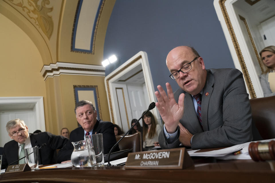 House Rules Committee Chairman Jim McGovern, D-Mass., joined from left by Rep. Rob Woodall, R-Ga., and Rep. Tom Cole, R-Okla., presides over a markup of the resolution that will formalize the next steps in the impeachment inquiry of President Donald Trump, at the Capitol in Washington, Wednesday, Oct. 30, 2019. Democrats have been investigating Trump's withholding of military aid to Ukraine as he pushed the country's new president to investigate Democrats and the family of rival presidential contender Joe Biden. (AP Photo/J. Scott Applewhite)