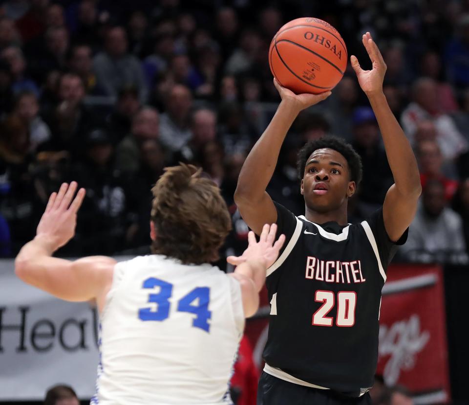 Buchtel Stevie Diamond, facing, attempts a three over Bishop Ready forward Kaleb Schaffer during the first half of a Division II state semifinal basketball game at UD Arena, Friday, March 17, 2023, in Dayton, Ohio.