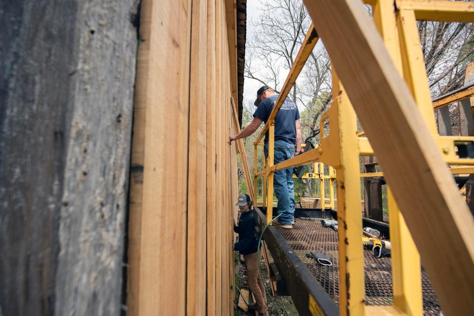 R.L. Blanton Construction workers Wade Simpson, top, and Dylan Ibarra, both of Natchez, install a new board and batten exterior wall at Wagner’s Grocery in Church Hill, Miss., on Wednesday, March 27, 2024. The store, built around 1870, is one of the oldest country stores in Mississippi and is being restored by the Historic Natchez Foundation.