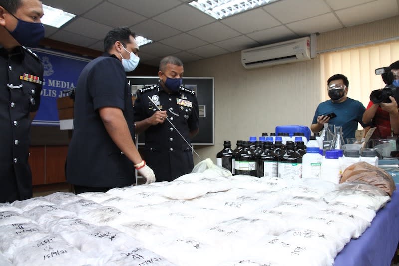 Johor police chief Datuk Ayob Khan Mydin Pitchay with the drugs seized after a series of raids in Johor Baru and Iskandar Puteri districts yesterday, September 17, 2021 — Picture by Ben Tan