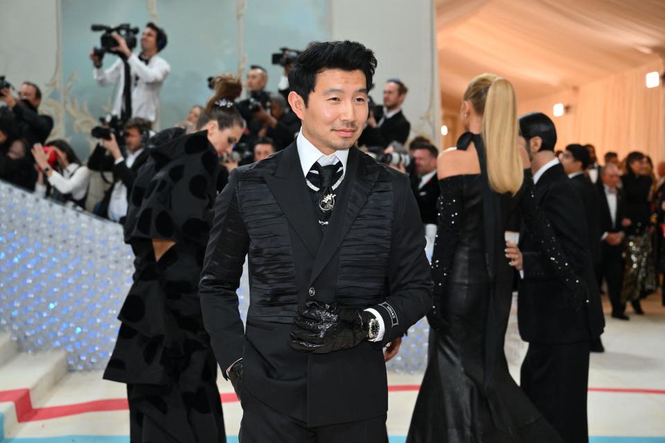 Canadian actor Simu Liu arrives for the 2023 Met Gala at the Metropolitan Museum of Art on May 1, 2023, in New York. - The Gala raises money for the Metropolitan Museum of Art's Costume Institute. The Gala's 2023 theme is "Karl Lagerfeld: A Line of Beauty." (Photo by ANGELA WEISS / AFP) (Photo by ANGELA WEISS/AFP via Getty Images)