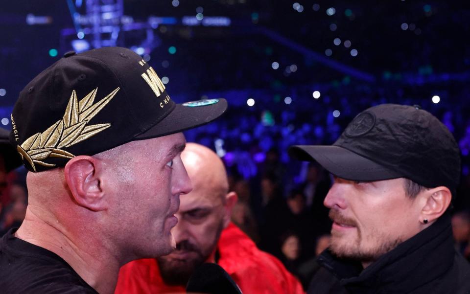 Boxing - WBC World Heavyweight Title - Tyson Fury v Derek Chisora - Tottenham Hotspur Stadium, London, Britain - December 3, 2022 Tyson Fury with Oleksandr Usyk after the fight - Action Images via Reuters