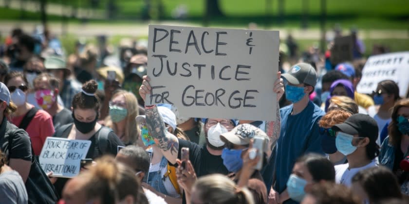 MINNEAPOLIS , MINNESOTA - MAY 31: Thousands of protesters gather at the Minnesota State Capitol on Sunday to demand justice for George Floyd as the Minnesota National Guard secured the perimeter of the capitol building on Sunday, May 31, 2020 in Minneapolis , Minnesota.