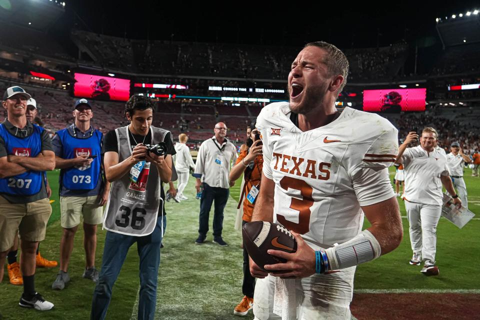 Texas quarterback Quinn Ewers celebrates the Longhorns' win over Alabama at Bryant-Denny Stadium last September. Ewers is 16-6 as a starter and was affirmed Wednesday by head coach Steve Sarkisian that he's still atop the depth chart.