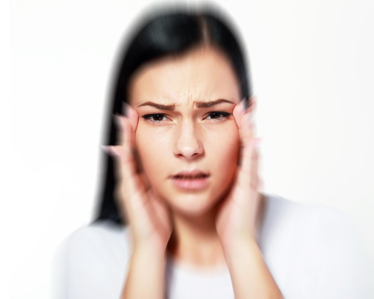 woman over white with blurred vision and trouble focusing