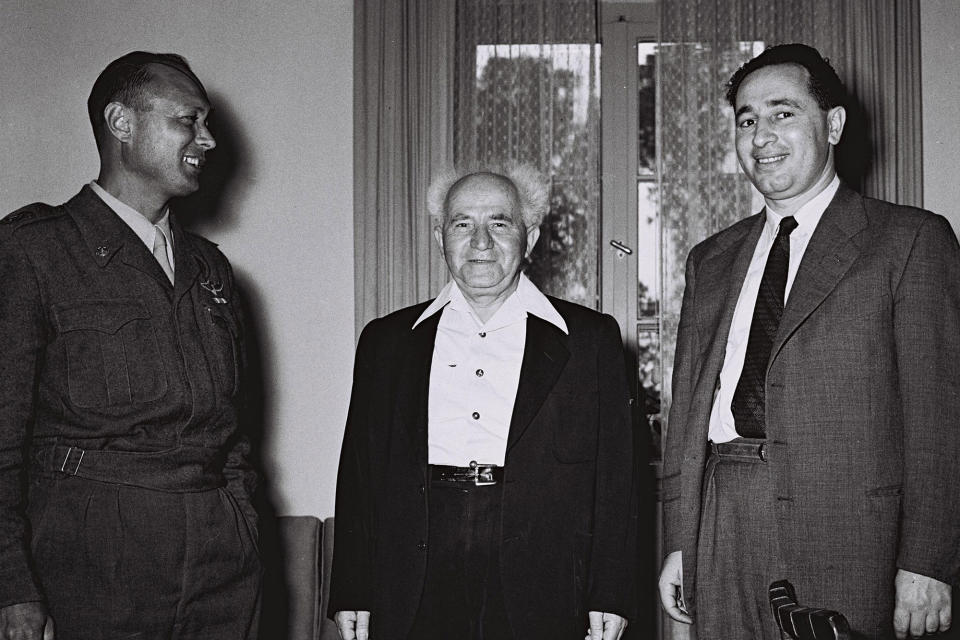 <p>Israel’s Defence Minister David Ben Gurion (C) stands with Moshe Dayan, the military’s Chief of Staff, and Director General of the Ministry of Defence Shimon Peres (R) at Ministry in Tel Aviv February 2, 1955. (REUTERS/Hans Pinn/GPO) </p>