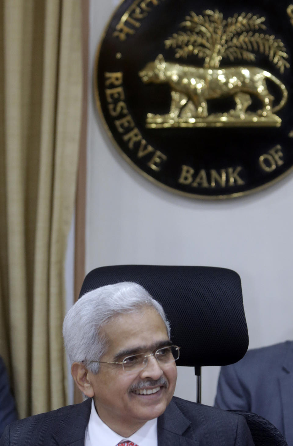 Reserve Bank of India Governor Shaktikanta Das addresses a press conference in Mumbai, India, Thursday, June 6, 2019. India's central bank has cut its key interest rate by a quarter of a percentage point to 5.75% from 6% with immediate effect to fortify the economy as consumer spending and corporate investment falter. (AP Photo/Rajanish Kakade)