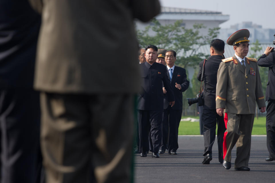 North Korean leader Kim Jong-Un (C) arrives to attend the inauguration of a Korean war military cemetery in Pyongyang on July 25, 2013. (Ed Jones/AFP/Getty Images)