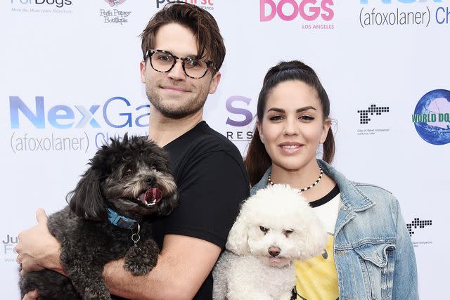 <p>Amanda Edwards/Getty</p> Tom Schwartz (L) and Katie Maloney and their dogs Gordo and Butter attend the Lisa Vanderpump and The Vanderpump Dog Foundation's 3rd Annual World Dog Day at West Hollywood Park on May 19, 2018 in West Hollywood, California.