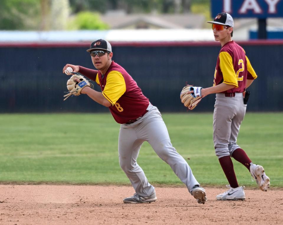 Tulare Union's Jeremiah Flores looks to first against Garces on Monday, March 25, 2024 in the 40th annual Tulare/Visalia PRO-PT Baseball Invitational at Tulare Western High School.