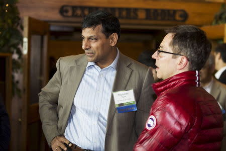 Reserve Bank of India Governor Raghuram Rajan (L) talks with University of Chicago Professor Randall Kroszner during the Federal Reserve Bank of Kansas City's annual Jackson Hole Economic Policy Symposium in Jackson Hole, Wyoming, August 29, 2015. REUTERS/Jonathan Crosby