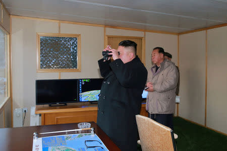 FILE PHOTO: North Korean leader Kim Jong Un guides the test-fire of Pukguksong-2 on the spot, in this undated photo released by North Korea's Korean Central News Agency (KCNA) in Pyongyang February 13, 2017. KCNA/Handout via Reuters/File Photo